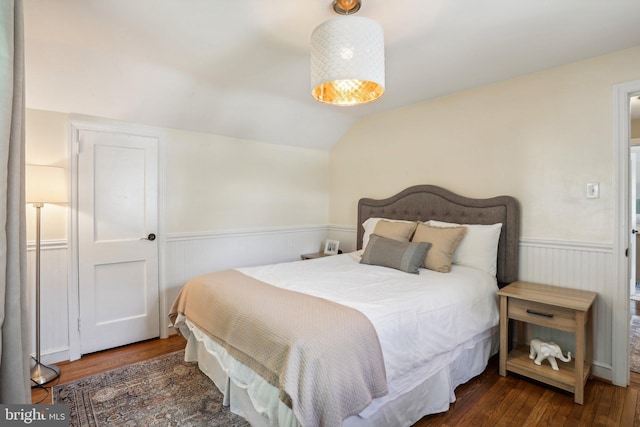 bedroom featuring dark hardwood / wood-style floors and vaulted ceiling