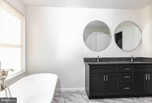 bathroom featuring vanity and a tub