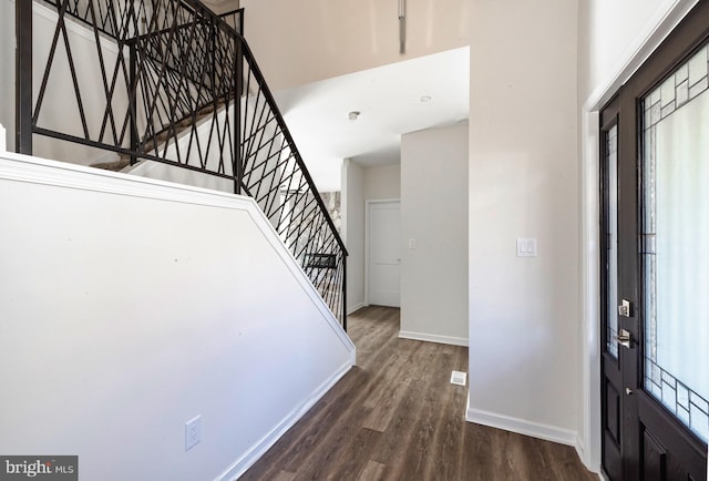 foyer with dark hardwood / wood-style floors