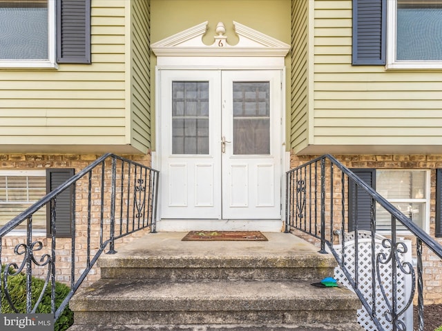 view of exterior entry featuring french doors