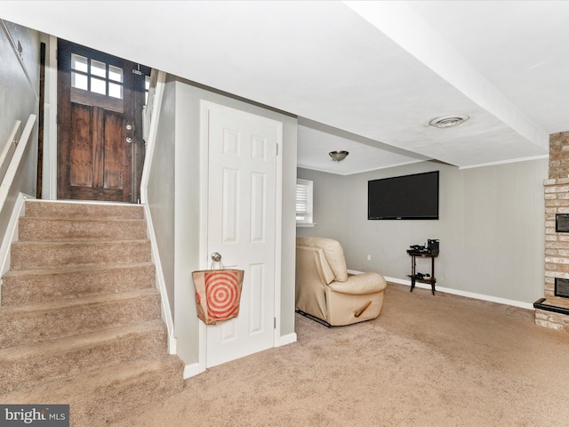 sitting room with a fireplace, carpet floors, and a healthy amount of sunlight