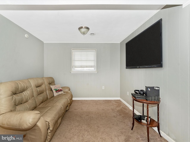 living room featuring carpet and crown molding