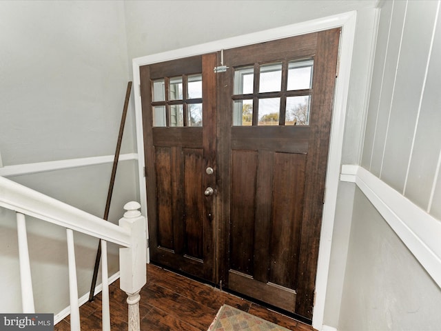 foyer entrance with dark wood-type flooring