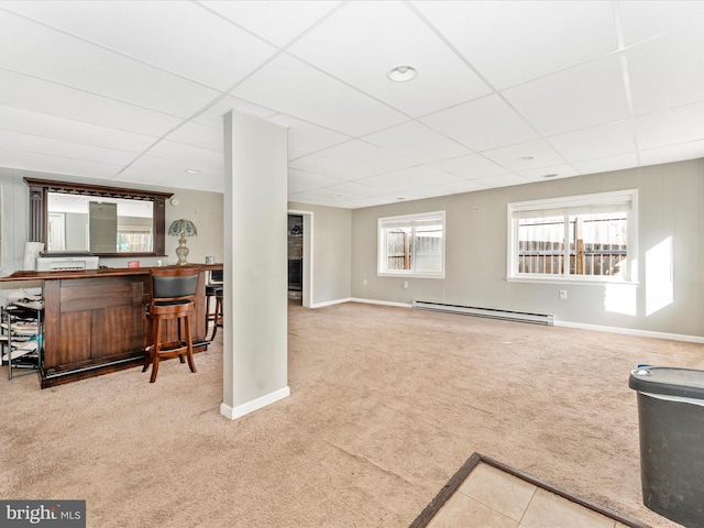 living room with a paneled ceiling, a baseboard radiator, bar, and light colored carpet