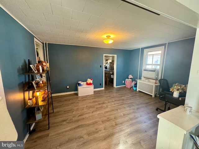 interior space featuring wood-type flooring and cooling unit