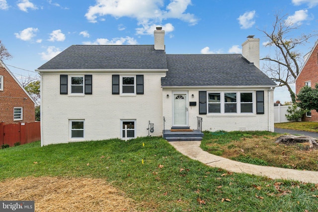 split level home with a front lawn