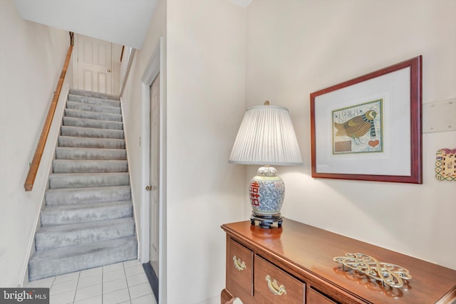 stairway featuring tile patterned floors