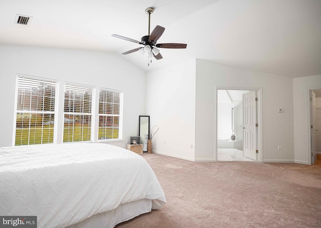 carpeted bedroom featuring ensuite bathroom, ceiling fan, and lofted ceiling