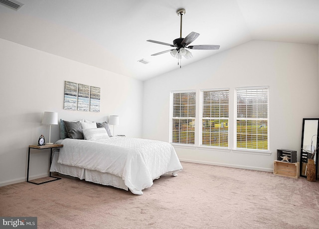 bedroom with carpet flooring, ceiling fan, and vaulted ceiling