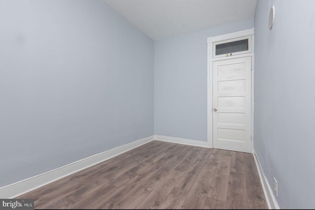 unfurnished room with hardwood / wood-style flooring