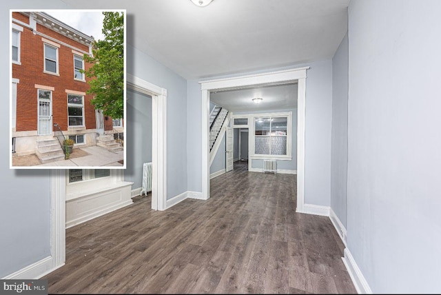 corridor with dark hardwood / wood-style floors