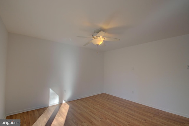 spare room featuring ceiling fan and light wood-type flooring