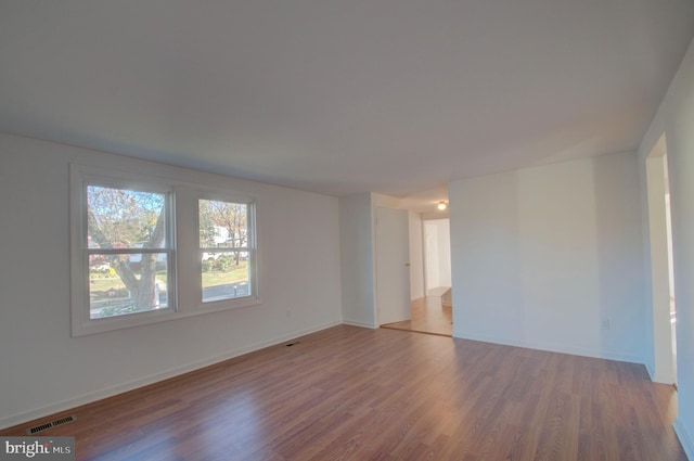 spare room featuring hardwood / wood-style floors