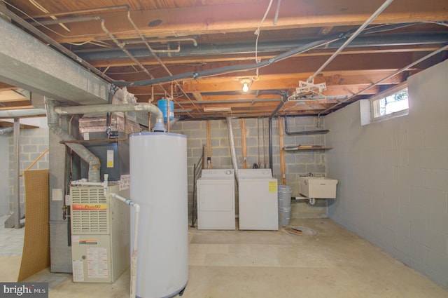 basement with independent washer and dryer, sink, heating unit, and water heater