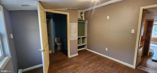 unfurnished bedroom with dark hardwood / wood-style floors