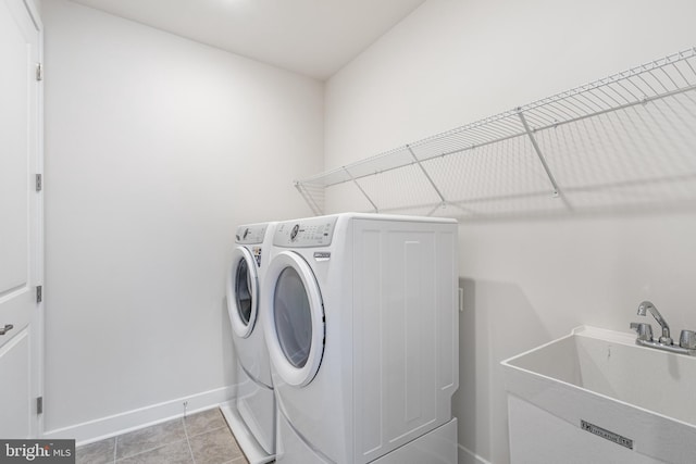 110 Stilly Way, Annapolis, MD 21403 - washroom featuring washing machine and dryer, baseboards, and light tile patterned flooring