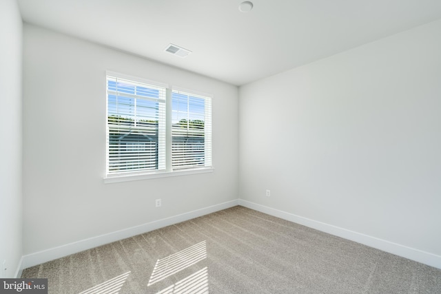 unfurnished room featuring carpet floors