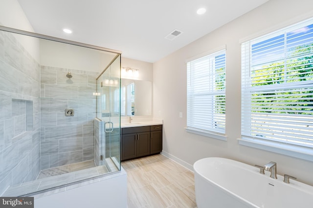 110 Stilly Way, Annapolis, MD 21403 - bathroom with vanity, baseboards, a stall shower, a freestanding bath, and recessed lighting
