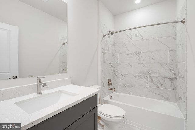 full bathroom with vanity, toilet, and tiled shower / bath