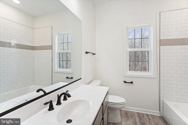 bathroom featuring vanity, toilet, and wood-type flooring