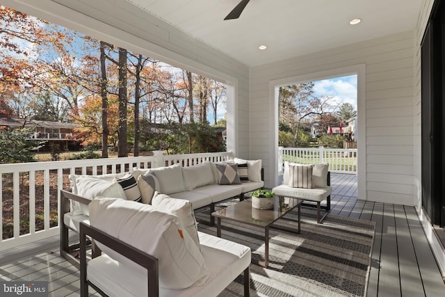 wooden terrace with outdoor lounge area