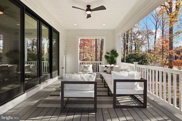 deck featuring an outdoor living space and ceiling fan