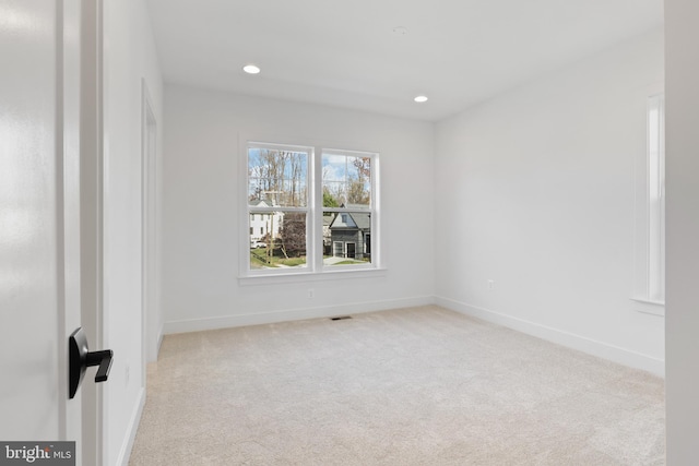 empty room featuring light colored carpet