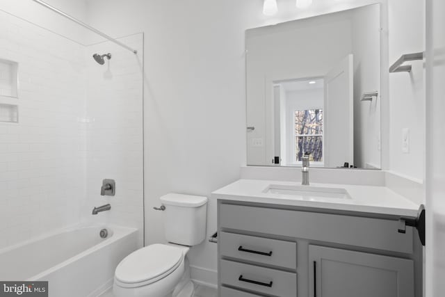 full bathroom with vanity, toilet, and tiled shower / bath