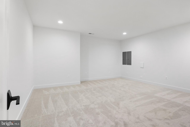 carpeted empty room featuring electric panel