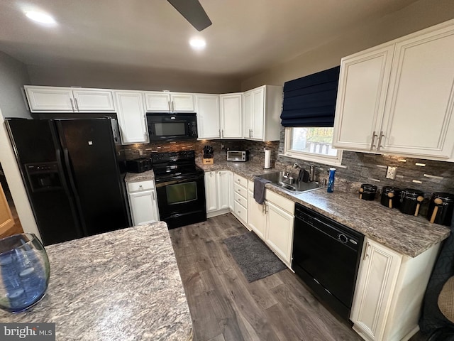 kitchen featuring light stone countertops, tasteful backsplash, black appliances, white cabinets, and dark hardwood / wood-style floors