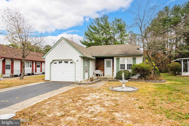 view of front of property featuring a front lawn and a garage