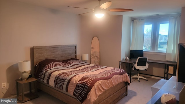 bedroom with light carpet and ceiling fan