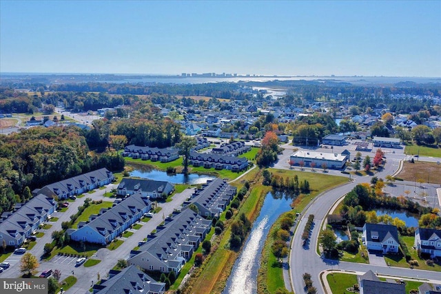 birds eye view of property featuring a residential view and a water view