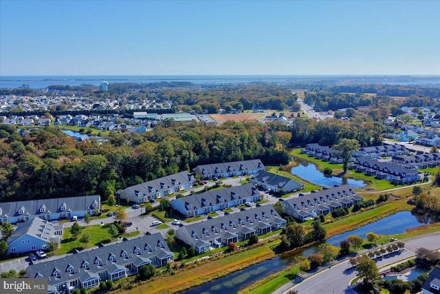 drone / aerial view featuring a water view and a residential view