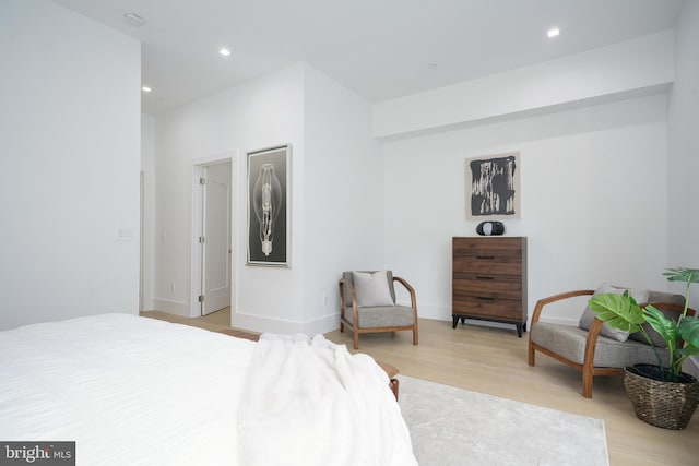 bedroom with light hardwood / wood-style floors