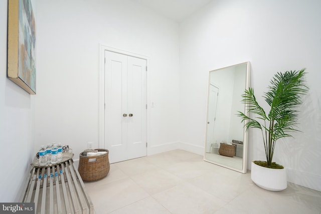 interior space with light tile patterned floors