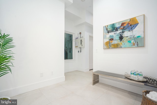 corridor with light tile patterned floors