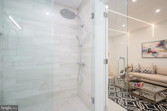 bathroom with a shower with shower door