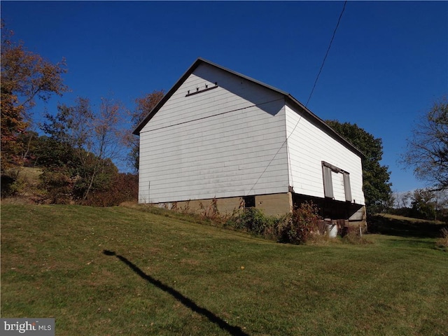 view of property exterior with a yard