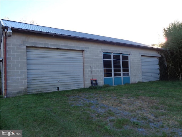 garage featuring a yard