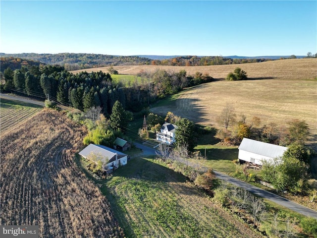 birds eye view of property featuring a rural view