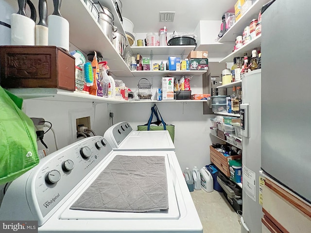 laundry area with washing machine and dryer