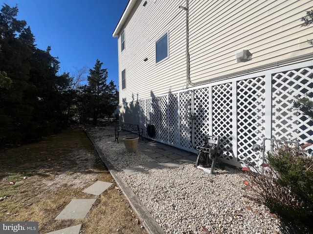 view of side of home with a patio area