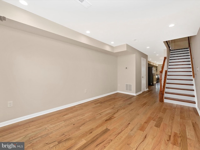 basement featuring light wood-type flooring