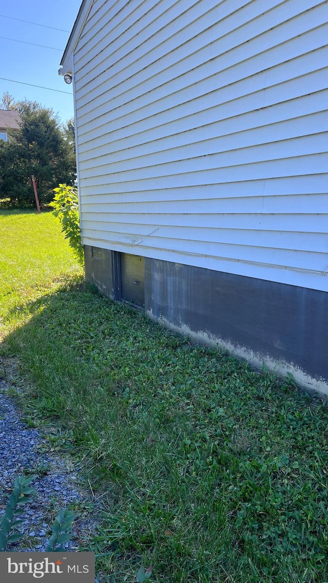 view of home's exterior featuring a yard