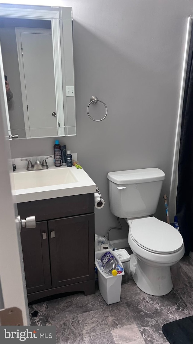 bathroom with vanity and toilet