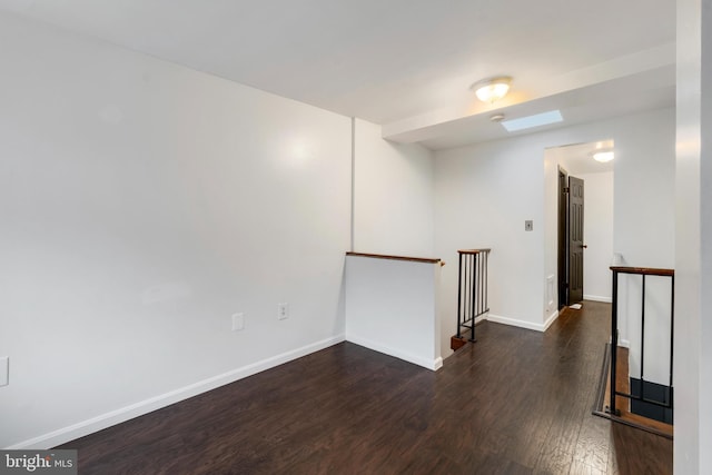 unfurnished room featuring dark hardwood / wood-style floors