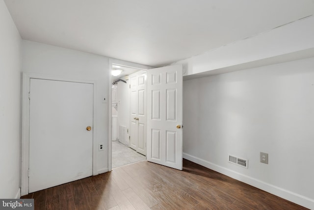 empty room featuring hardwood / wood-style flooring