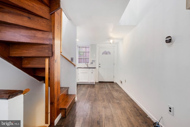 hall with hardwood / wood-style floors