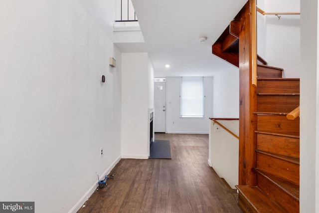 corridor with dark wood-type flooring